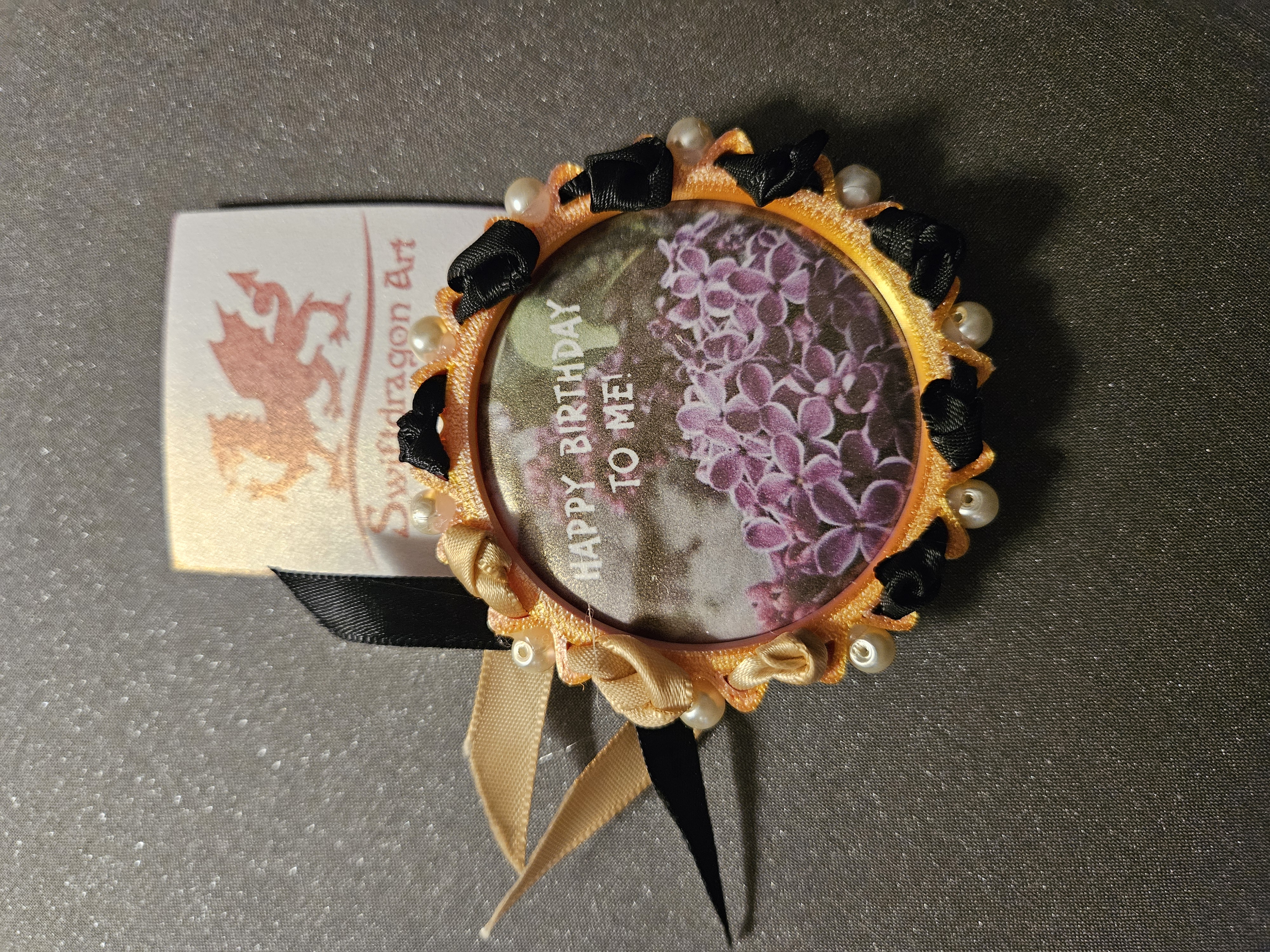 Birthday Celebration Piece — floral button with satin ribbon accents